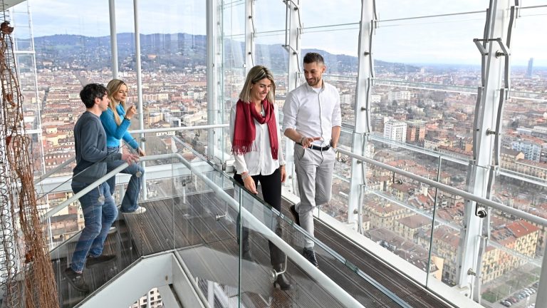 Image of a group of people climbing the stairs of the Intesa Sanpaolo skyscraper in Turin