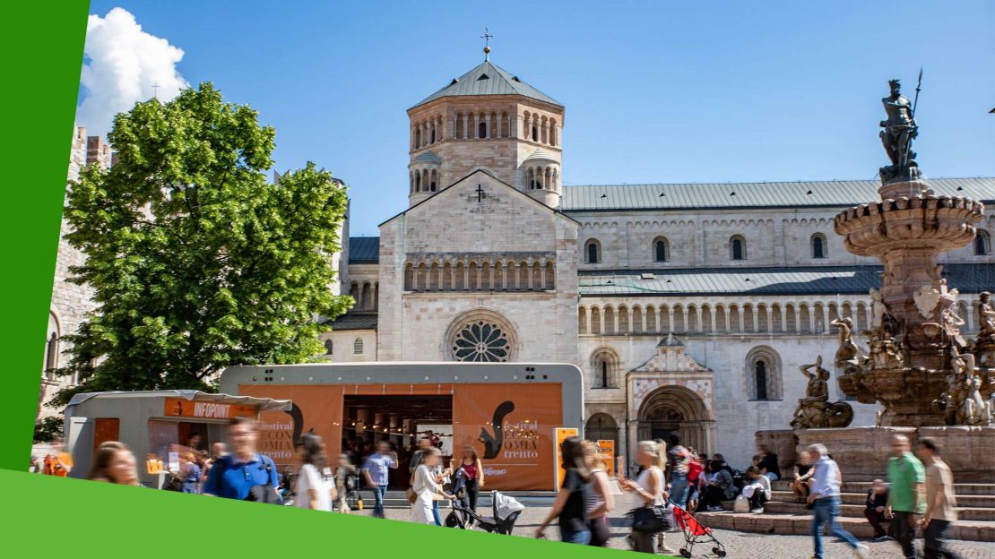 Immagine della città di Trento con riferimenti al Festival dell'economia