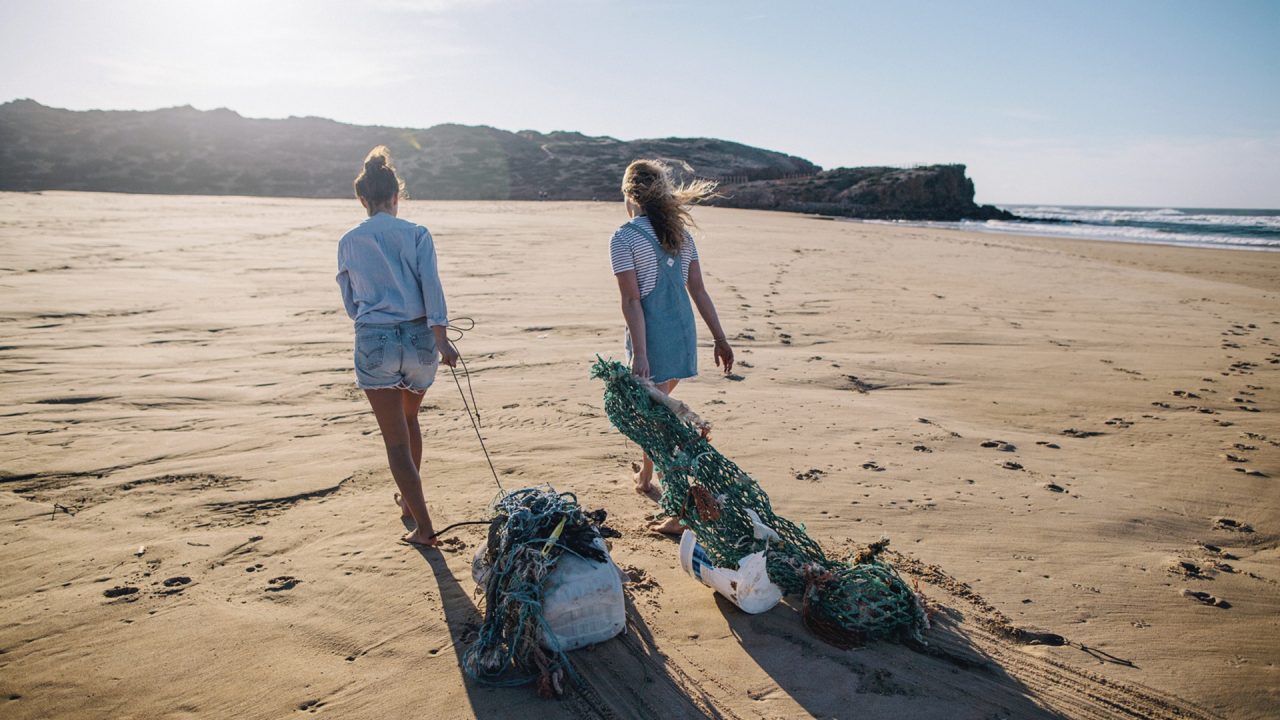 Image of people engaged in collect plastic